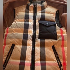 Burberry Vest it’s also reversible to all black with Burberry logo on it .
